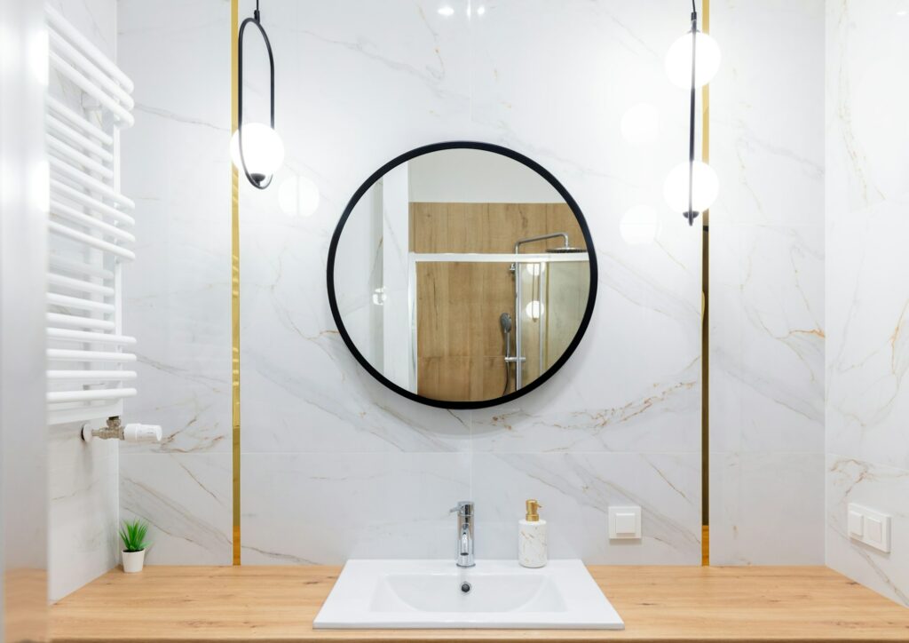 Elegant bathroom with marble walls and mirror